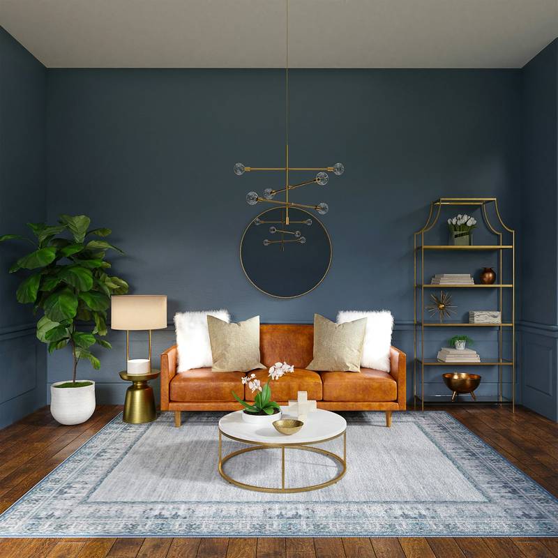 A sitting room with deep blue walls and a leather sofa. Reference photograph.